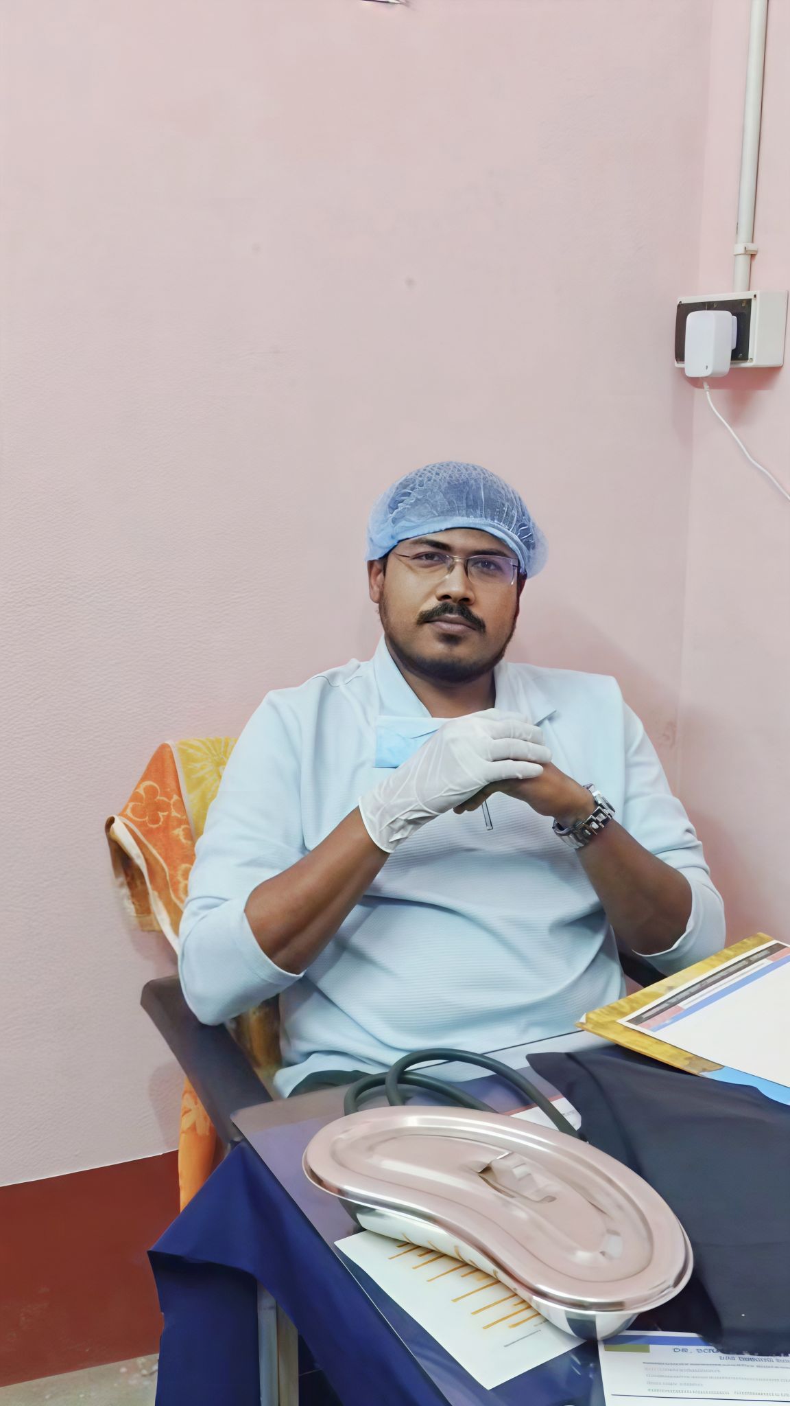 Dr. Soumik Karak examining a patient at the dental clinic